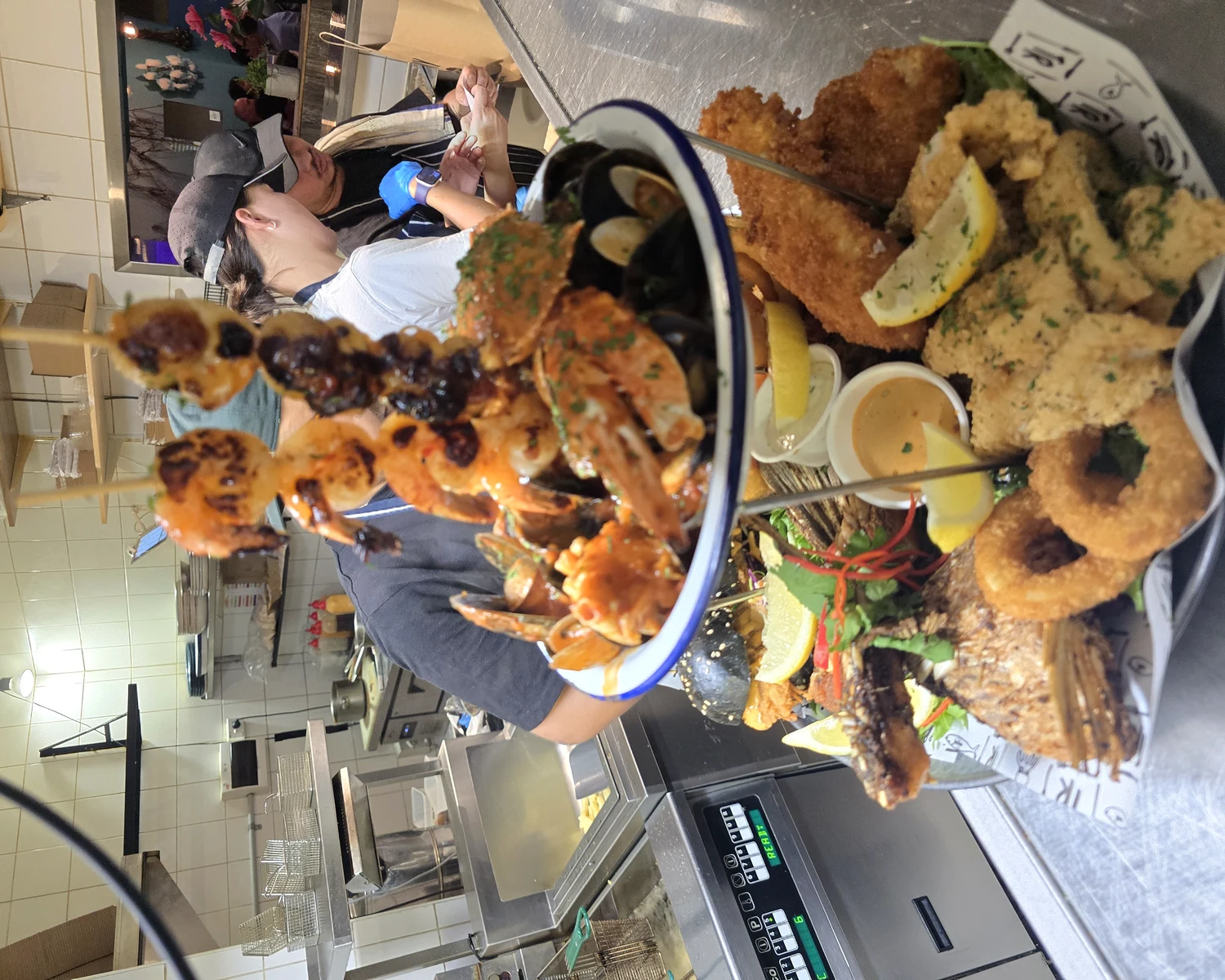 Large seafood platter shared around the table